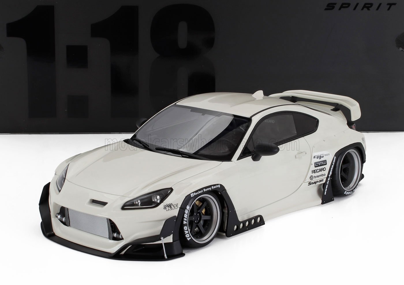 1:18 white Rocket Bunny race car model with wide body kit and spoiler, available at Vroomi