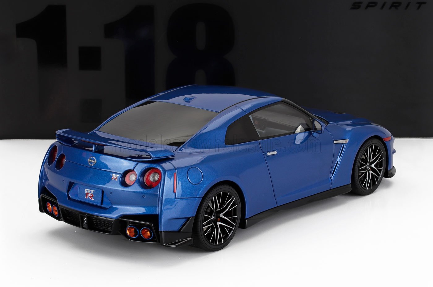 Blue Nissan GT-R scale model car 1:18 die-cast with detailed rear and black sports rims available on Vroomi