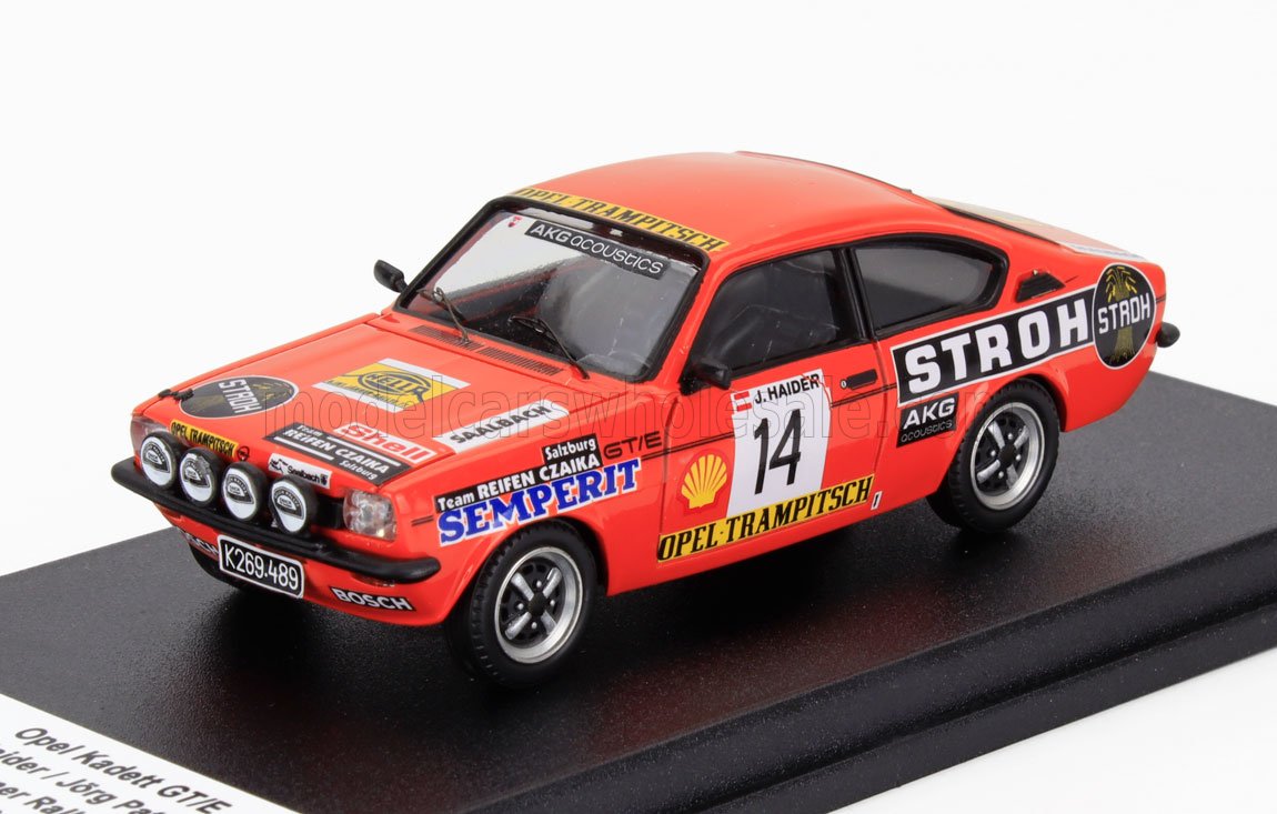 Red Opel Kadett GT/E rally model car with sponsor decals and number 14, offered through Vroomi