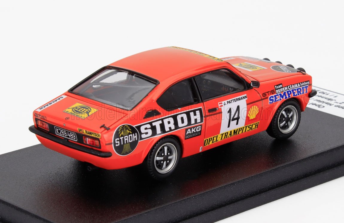 Red Opel racing car model with STROH and SEMPERIT logos on display stand, offered on Vroomi