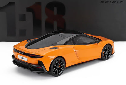 Orange and black McLaren GTS 1:18 scale model with sleek aerodynamic design available at Vroomi