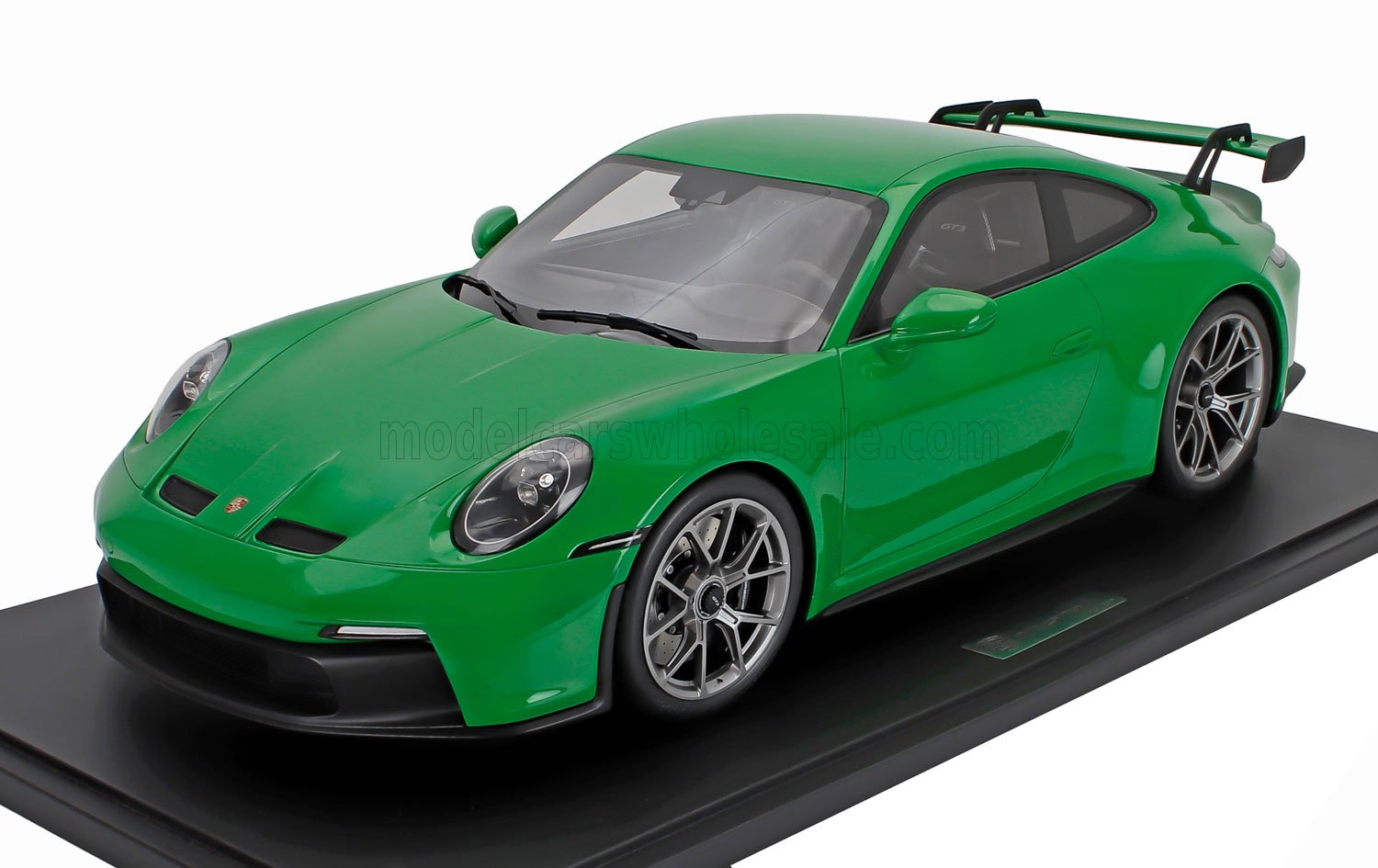 Green Porsche 911 GT3 scale model car in 1/18 die-cast displayed on black base, available at Vroomi