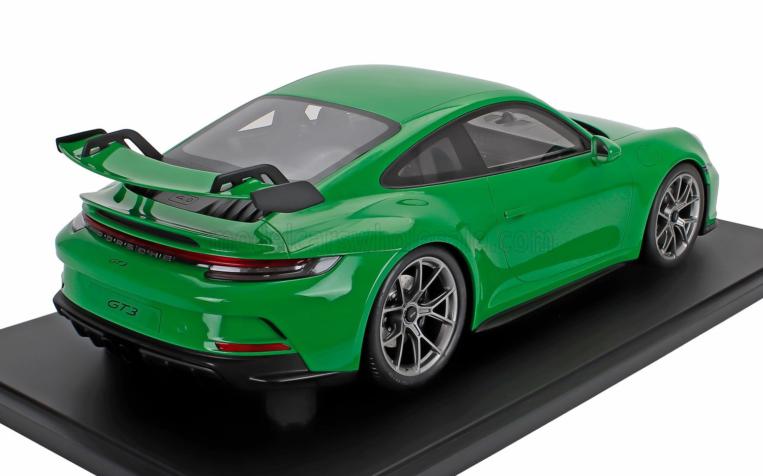 Green Porsche 911 GT3 1/18 scale diecast model car on black display base available at Vroomi