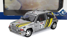 Silver diecast Renault 5 GT Turbo rally car model with yellow racing stripes, detailed decals, available on Vroomi