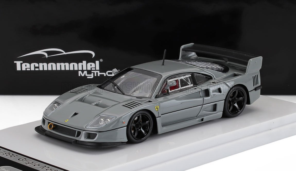 Gray Ferrari F40 scale model with black wheels on display platform, offered via Vroomi