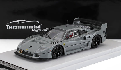 Gray Ferrari F40 scale model with black wheels on display platform, offered via Vroomi