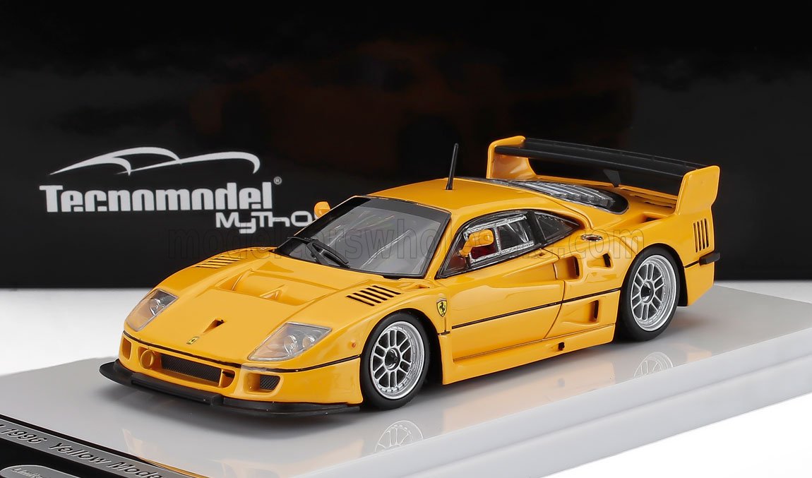 Yellow 1995 Ferrari F40 scale model by Tecnomodel displayed on white base, available through Vroomi