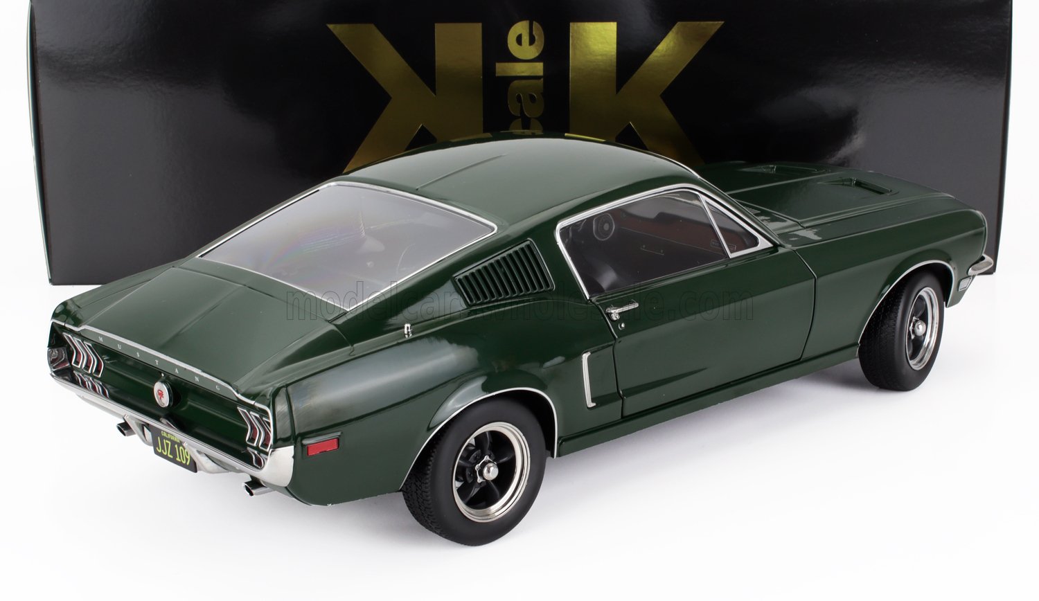 Dark green 1960s Ford Mustang model car rear side with black and gold packaging, available on Vroomi