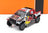 Voiture miniature Toyota Hilux Red Bull Rallye par Vroomi, avec décalcomanies de course et finition à l'échelle 1:18.