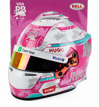 Roze en wit Formule 1-helm met palmbomen, Cash App-, Mobil 1- en ZURU-logo's — schaalmodel accessoire van Vroomi