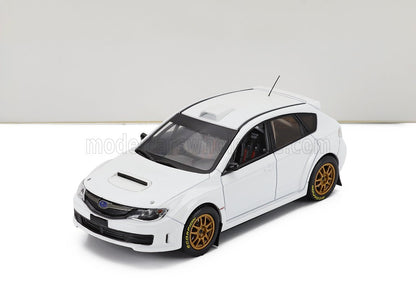 SUBARU - IMPREZA WRX STi N 0 RALLY SPEC 2011 - CON 2 JUEGOS DE LLANTAS Y NEUMÁTICOS - BLANCO. Maqueta de coche a escala en Vroomi