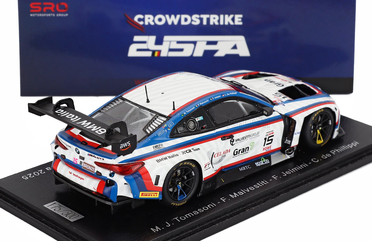 BMW M4 GT3 scale model car by Vroomi, detailed with racing decals and displayed on a collector's base.