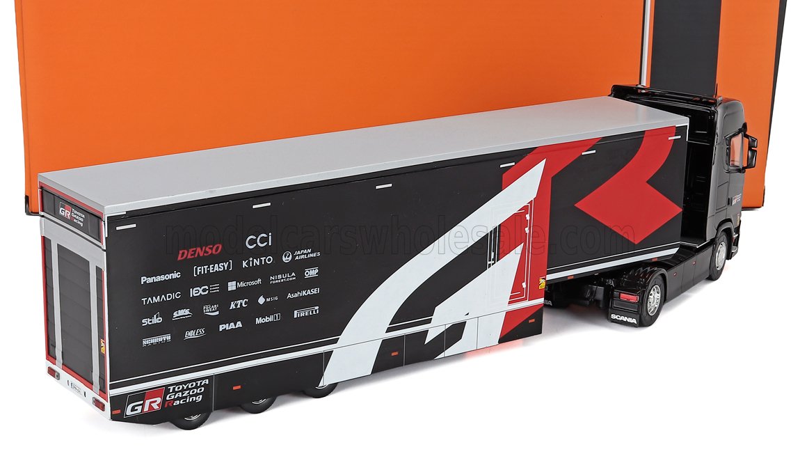 Miniature de camion porte-voiture Toyota Gazoo Racing par Vroomi, design noir et rouge avec logos de sponsors.