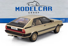 1:18 scale gold Audi Coupe GT die-cast model car with detailed exterior, available at Vroomi