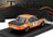 Orange and black BMW Alpina 2000 CS scale model car with race decals, displayed on stand at Vroomi