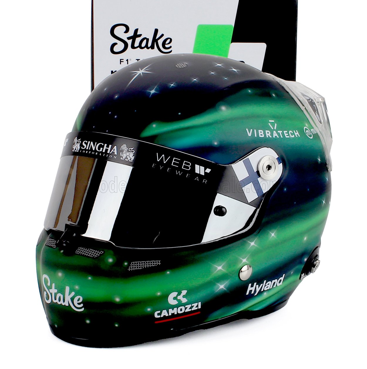 Vroomi scale model car driver helmet with Stake, Hyland, and Singha branding, featuring aurora green design