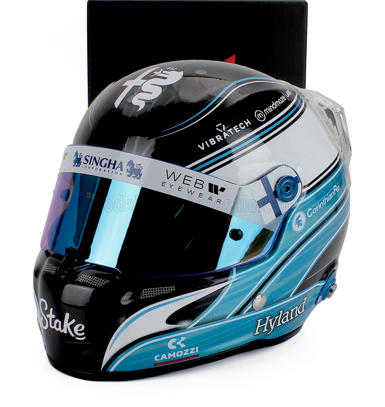 Scale model car racing helmet with blue and black livery, sponsor logos, and Vroomi branding