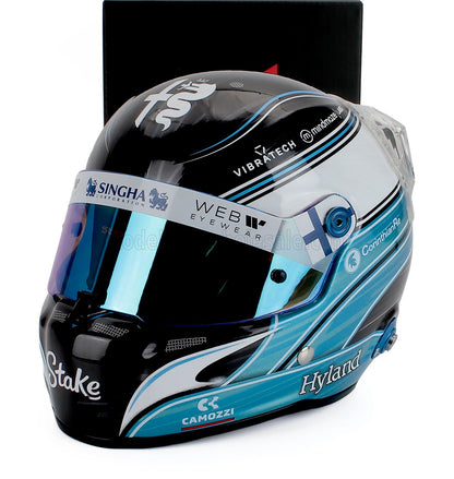 Scale model car racing helmet with blue and black livery, sponsor logos, and Vroomi branding