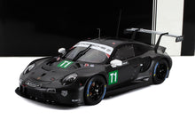 Black Porsche 911 GT3 race car model with green T1 decal, sponsor logos, and rear wing, offered on Vroomi