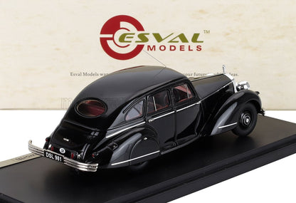 Black vintage Esval model car on display stand, classic sedan design, now offered on Vroomi