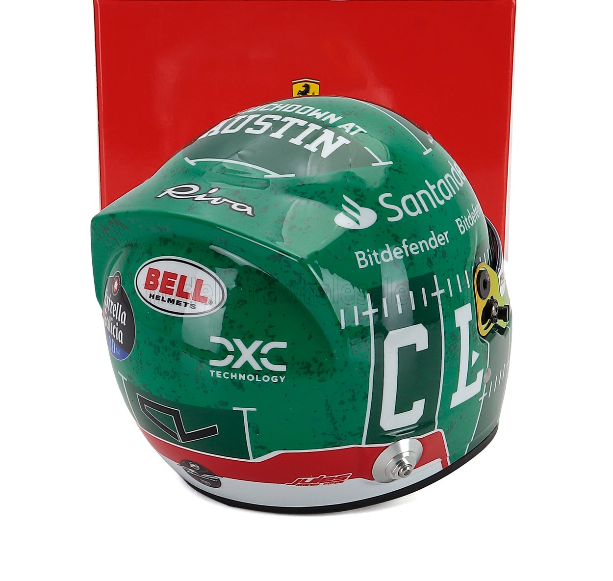 Green racing helmet scale model car collectible by Vroomi, featuring sponsor logos and Austin design