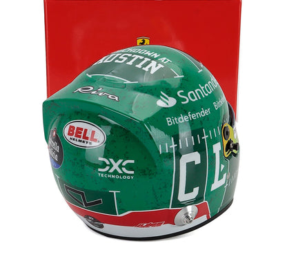 Green racing helmet scale model car collectible by Vroomi, featuring sponsor logos and Austin design