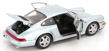 Silver Porsche 911 scale model car with open doors and engine bay, showcased by Vroomi for collectors