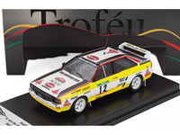 Modellino in scala dell'auto da corsa Audi Sport rally gialla e bianca con strisce nere e decalcomanie sponsor dal Rally del Portogallo 1984