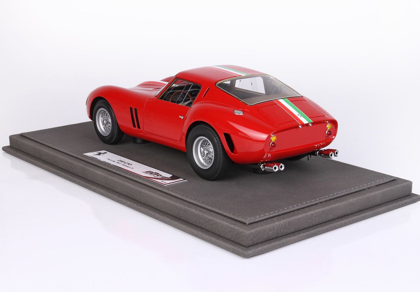 Red Ferrari 250 GTO model car with Italian stripe on leather base, available on Vroomi