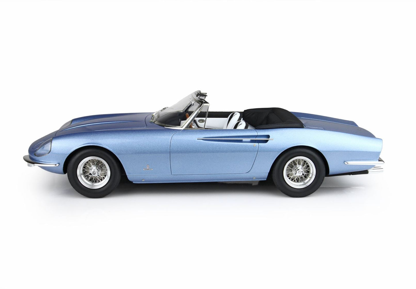 Side view of blue vintage convertible sports car with wire wheels and white interior, available via Vroomi