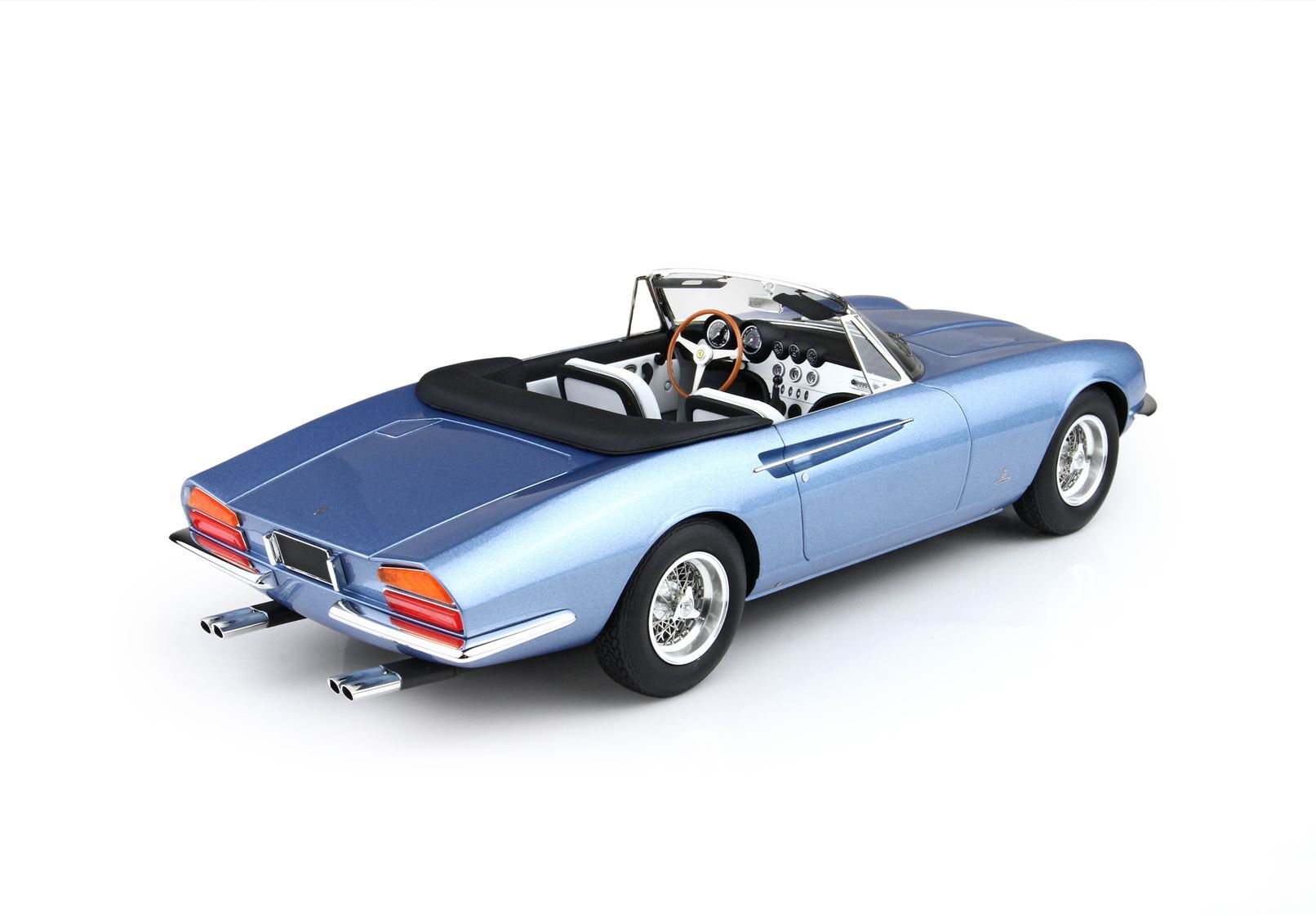 Metallic blue classic convertible car with wooden steering wheel and white interior, available through Vroomi