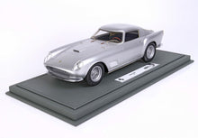 Silver 1958 Ferrari 250 TDF model car on gray display base, available through Vroomi
