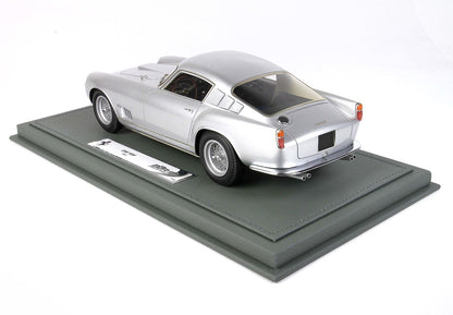 Silver Ferrari 250 TDF model car on green display base available via Vroomi platform