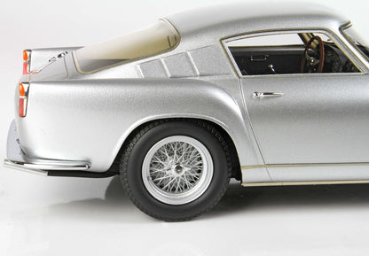 Silver classic sports car detailed side view with wire spoke wheel, featured on Vroomi