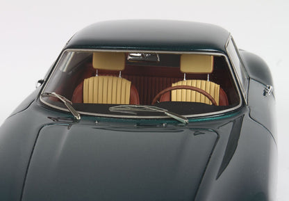 Close-up of dark green vintage car interior with tan leather seats and wooden steering wheel, available on Vroomi