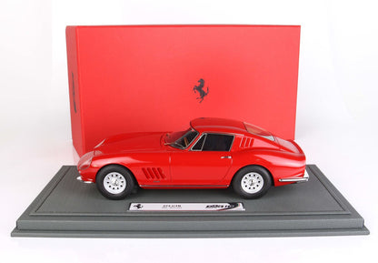 Red Ferrari 275 GTB 1:18 scale model on display stand with red Ferrari box, available on Vroomi