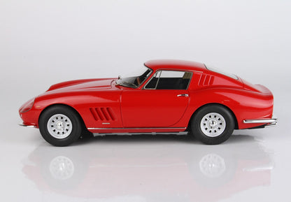 Red vintage sports car model with chrome wheels, available through Vroomi platform