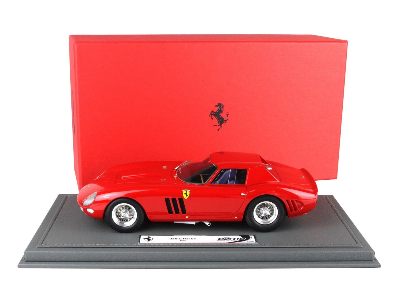Red Ferrari 250 GTO/64 scale model on gray base with red Ferrari box, available on Vroomi