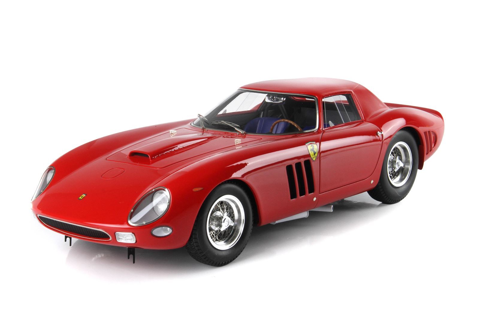 Classic red Ferrari sports car model with wire wheels and iconic logo, now offered on Vroomi