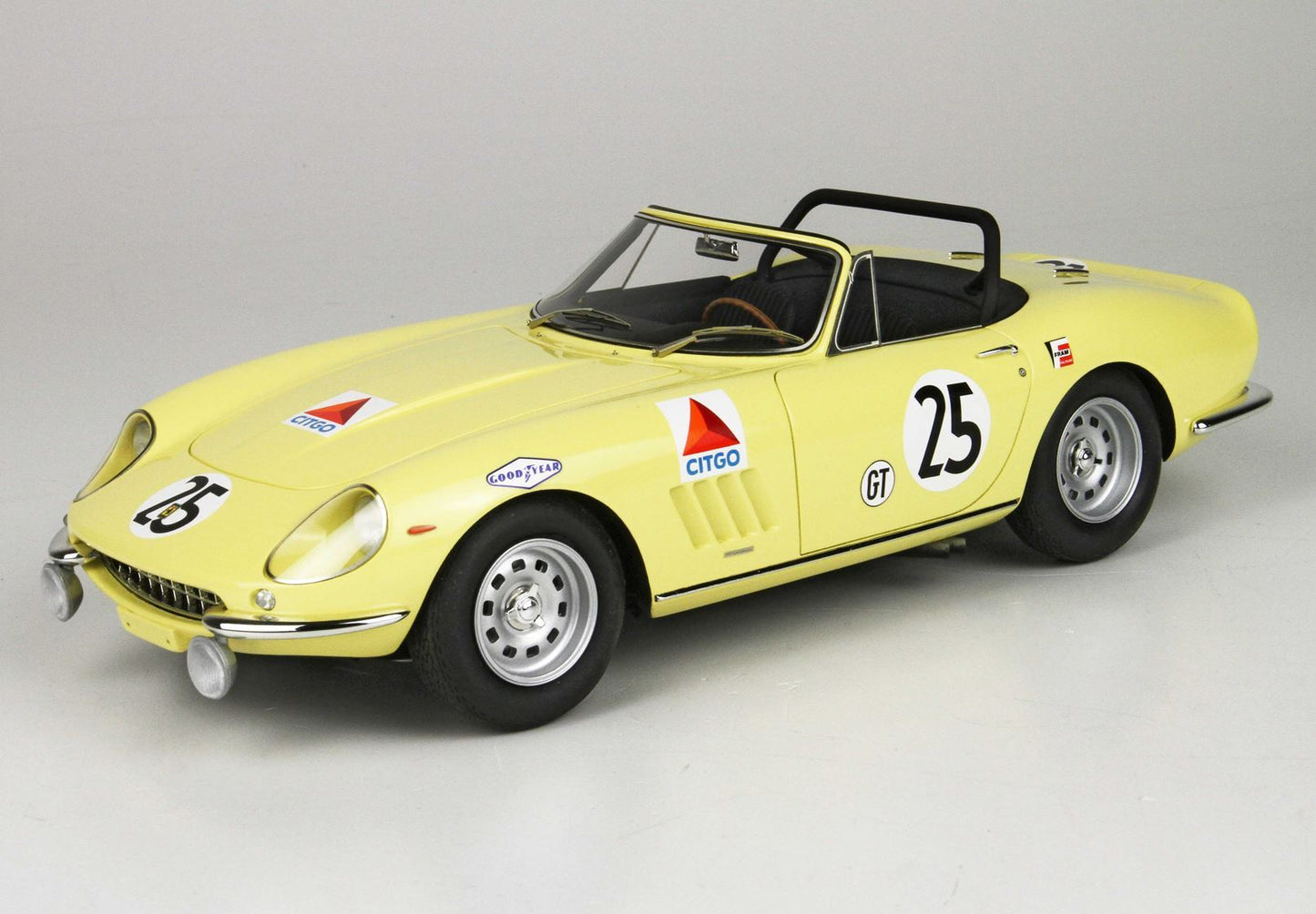 Yellow vintage race car with number 25, Citgo and Goodyear decals, open-top, available on Vroomi