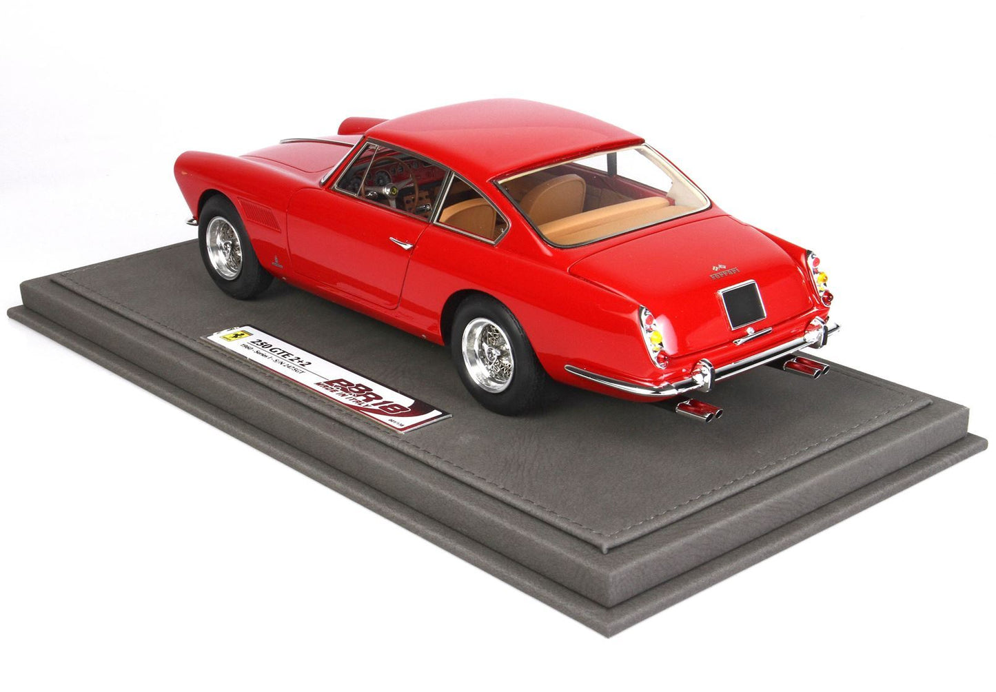 Red Ferrari 250 GTE 2+2 model car on gray display base, now available via Vroomi