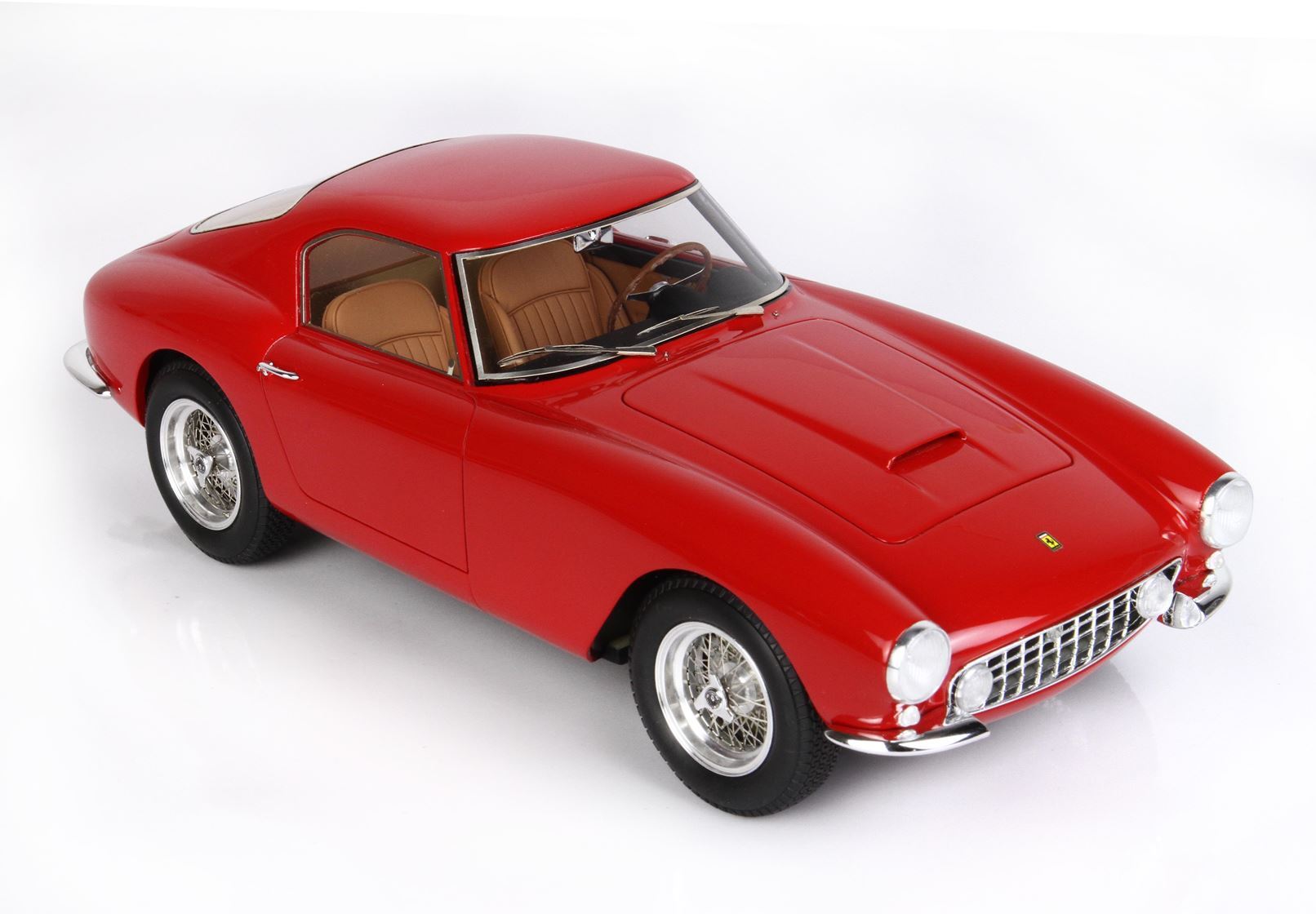 Red classic Ferrari coupe model with tan interior and wire-spoke wheels, offered on Vroomi