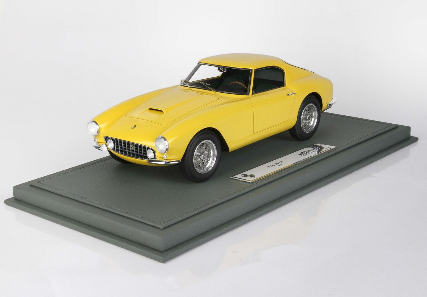 Yellow Ferrari 250 GT SWB model car on display stand available through Vroomi
