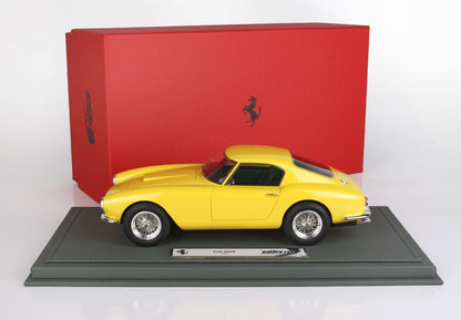 Yellow 1959 Ferrari 250 SWB model car on display base with red Ferrari logo box, available on Vroomi