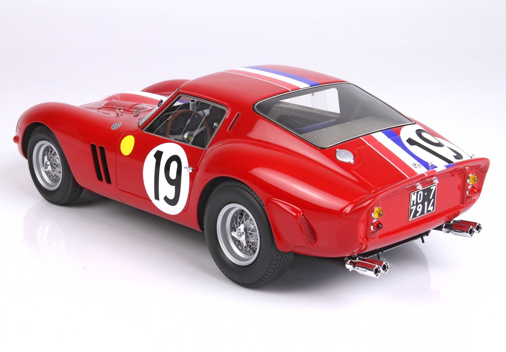 Red classic race car model with number 19 and racing stripes, featured on Vroomi