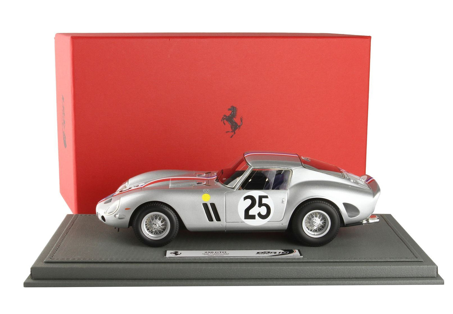 Silver Ferrari 250 GTO model car with number 25 on door displayed on gray stand, red Ferrari box behind, buy now on Vroomi