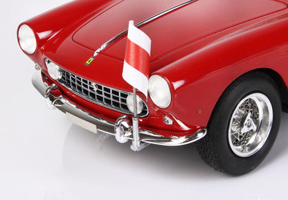 Close-up of red classic Ferrari model car front with chrome grille, headlights, and flag, offered on Vroomi