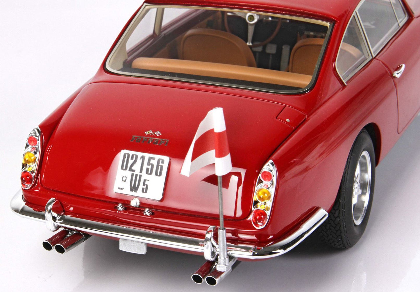 Rear view of red classic Ferrari model car with chrome bumper, detailed tail lights, and vintage license plate available on Vroomi