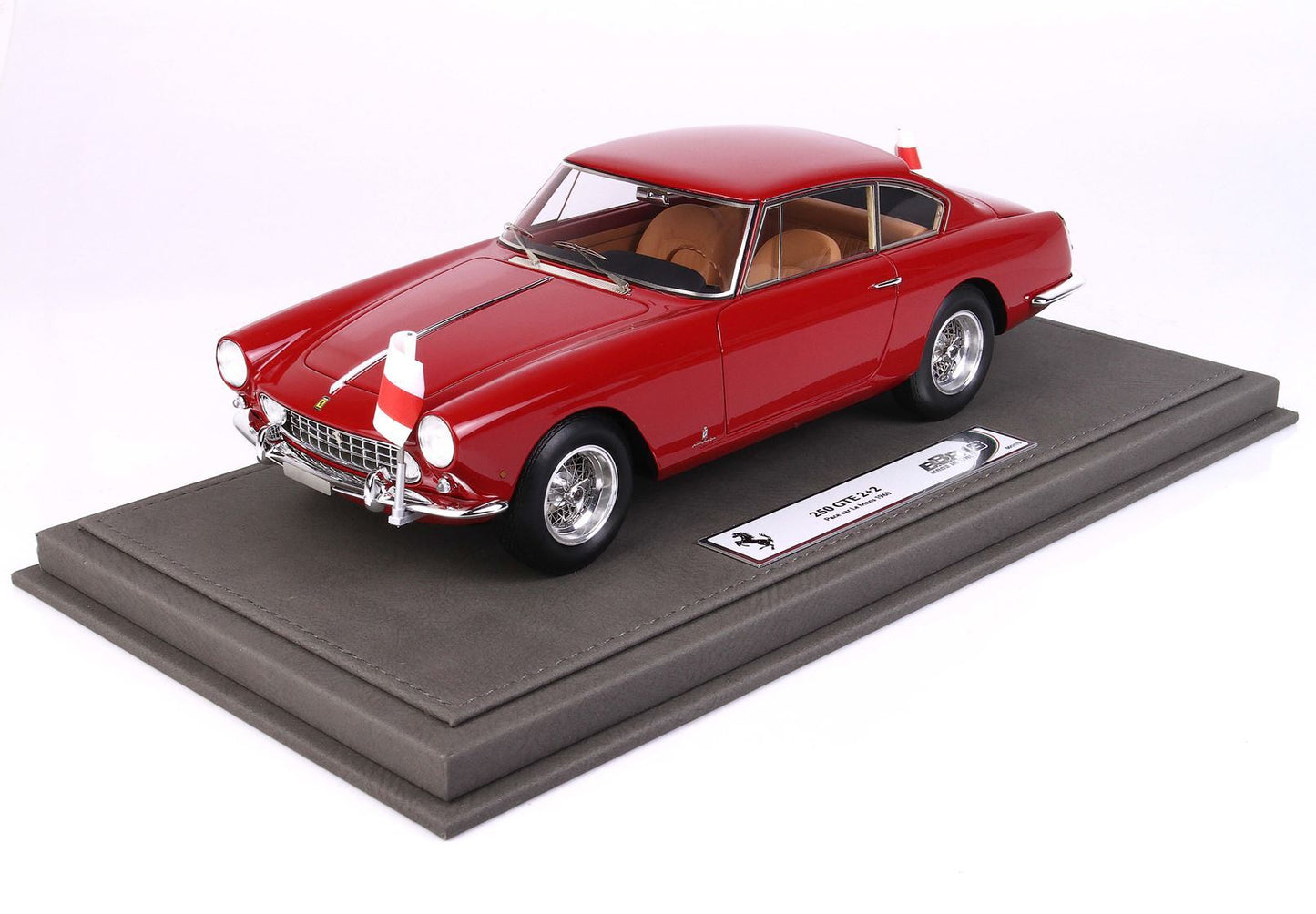 Red Ferrari 250 GTE 2+2 model car on grey display base, offered on Vroomi platform