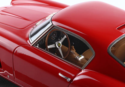 Close-up of a red Ferrari model car showing steering wheel and interior, available through Vroomi